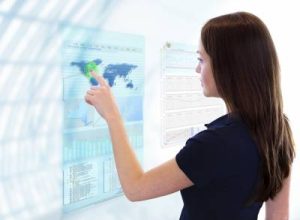 woman pressing globe on screen image