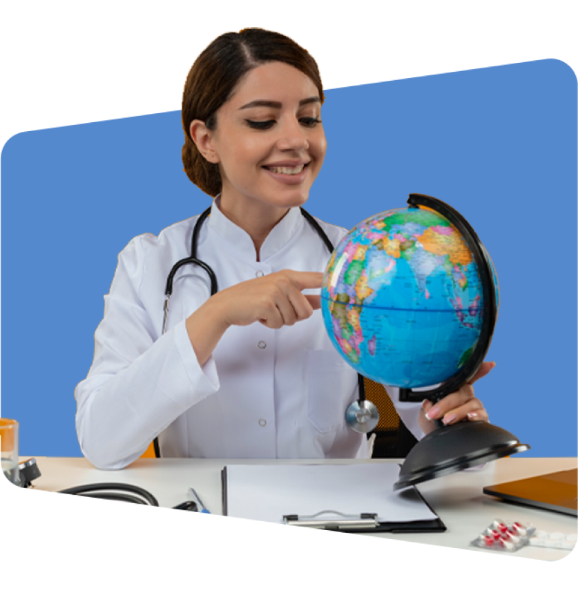 Doctor in white coat pointing at globe, with stethoscope, on blue background.