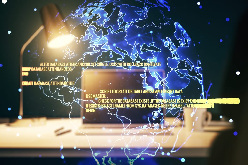Glowing globe overlaying laptop with database code, blue and yellow hues.