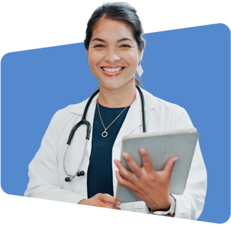 Smiling doctor holding tablet, wearing white coat and stethoscope, blue background.